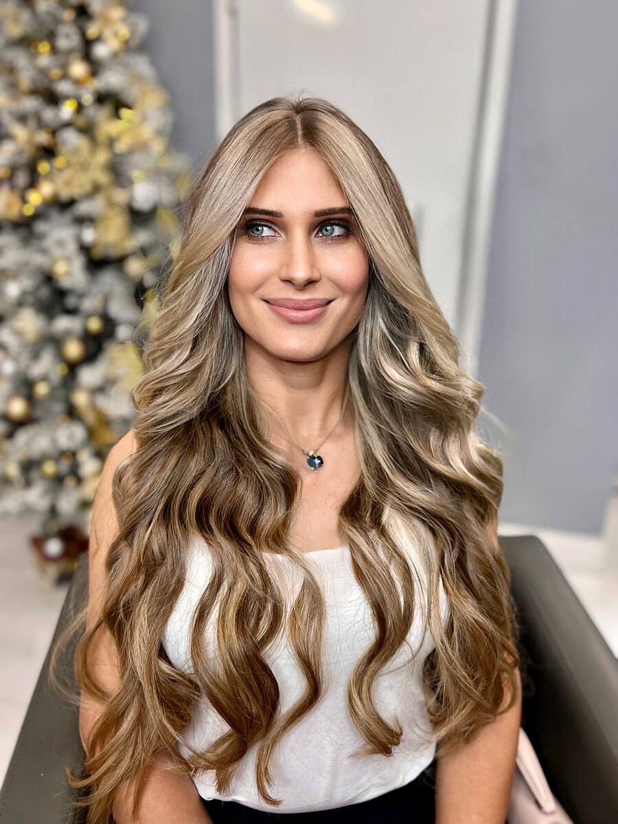 Status Hair client with natural-looking length and fullness from extensions