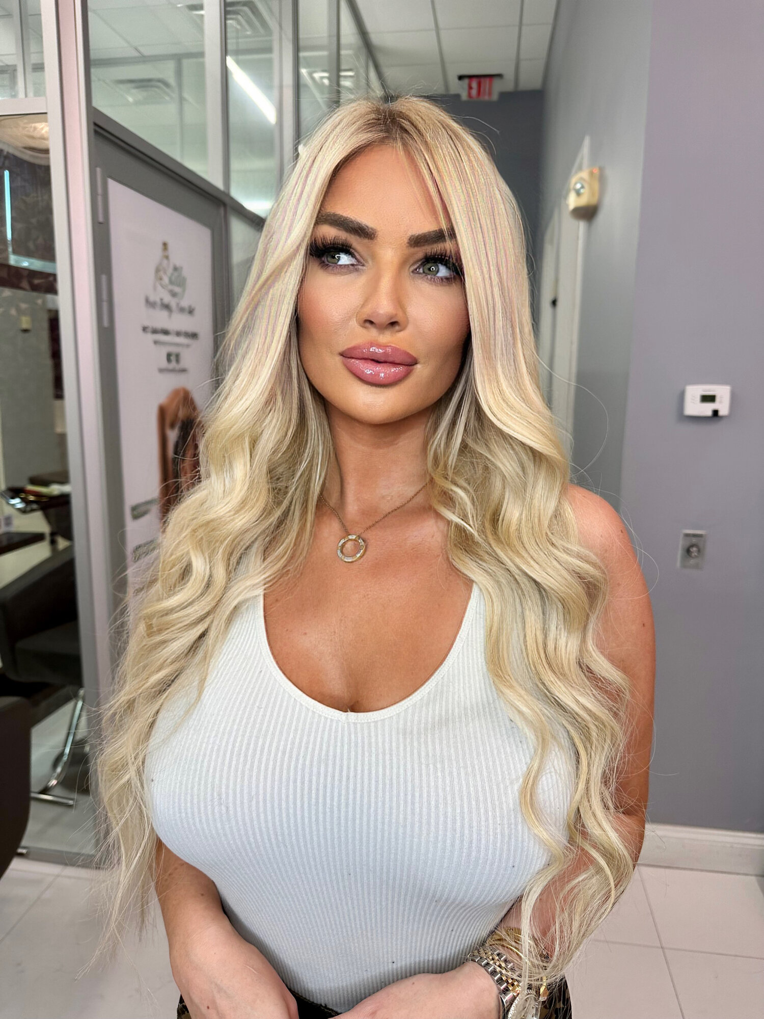 Status Hair client with sleek, straight extensions